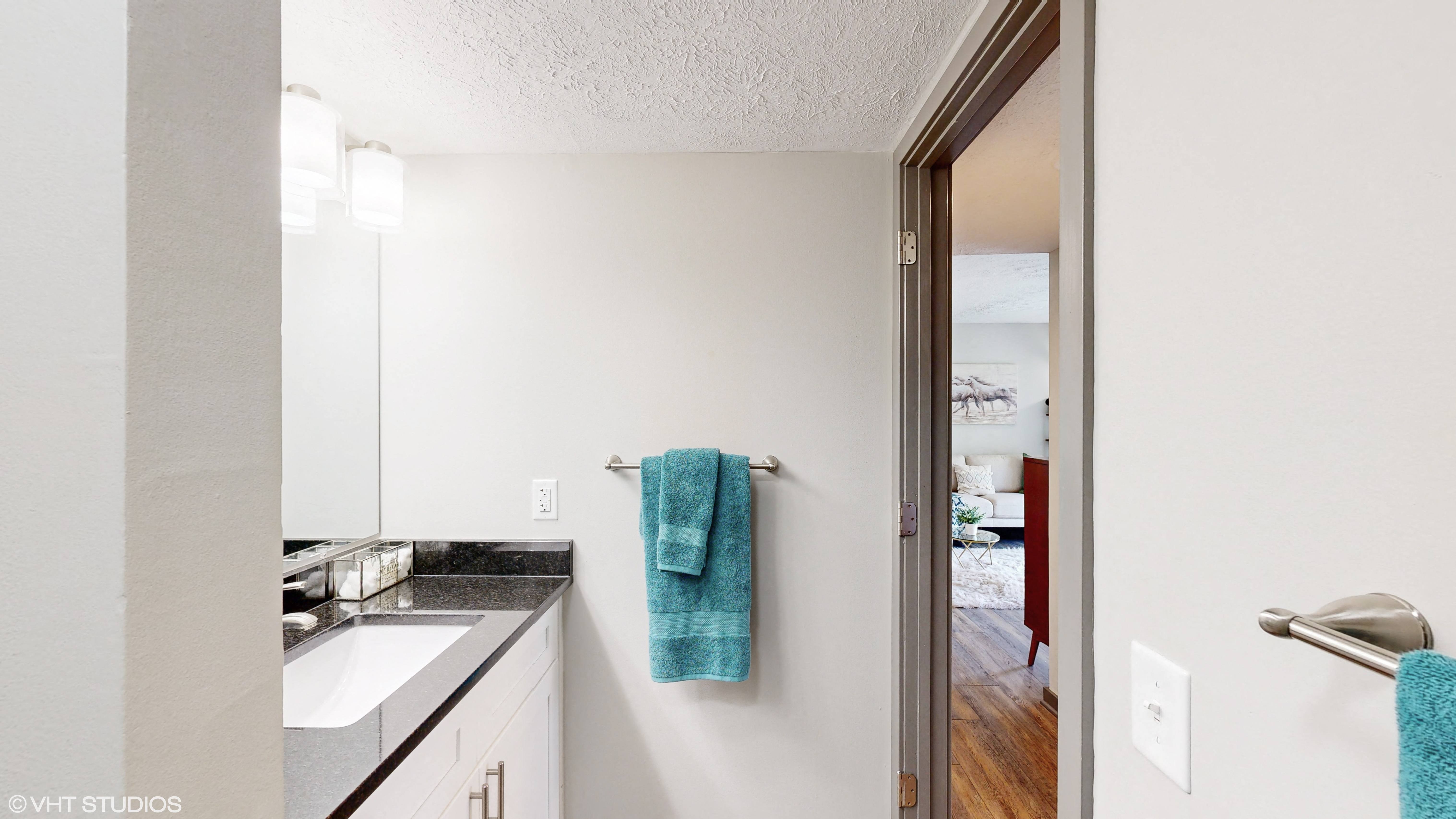 apartment bathroom vanity and entry