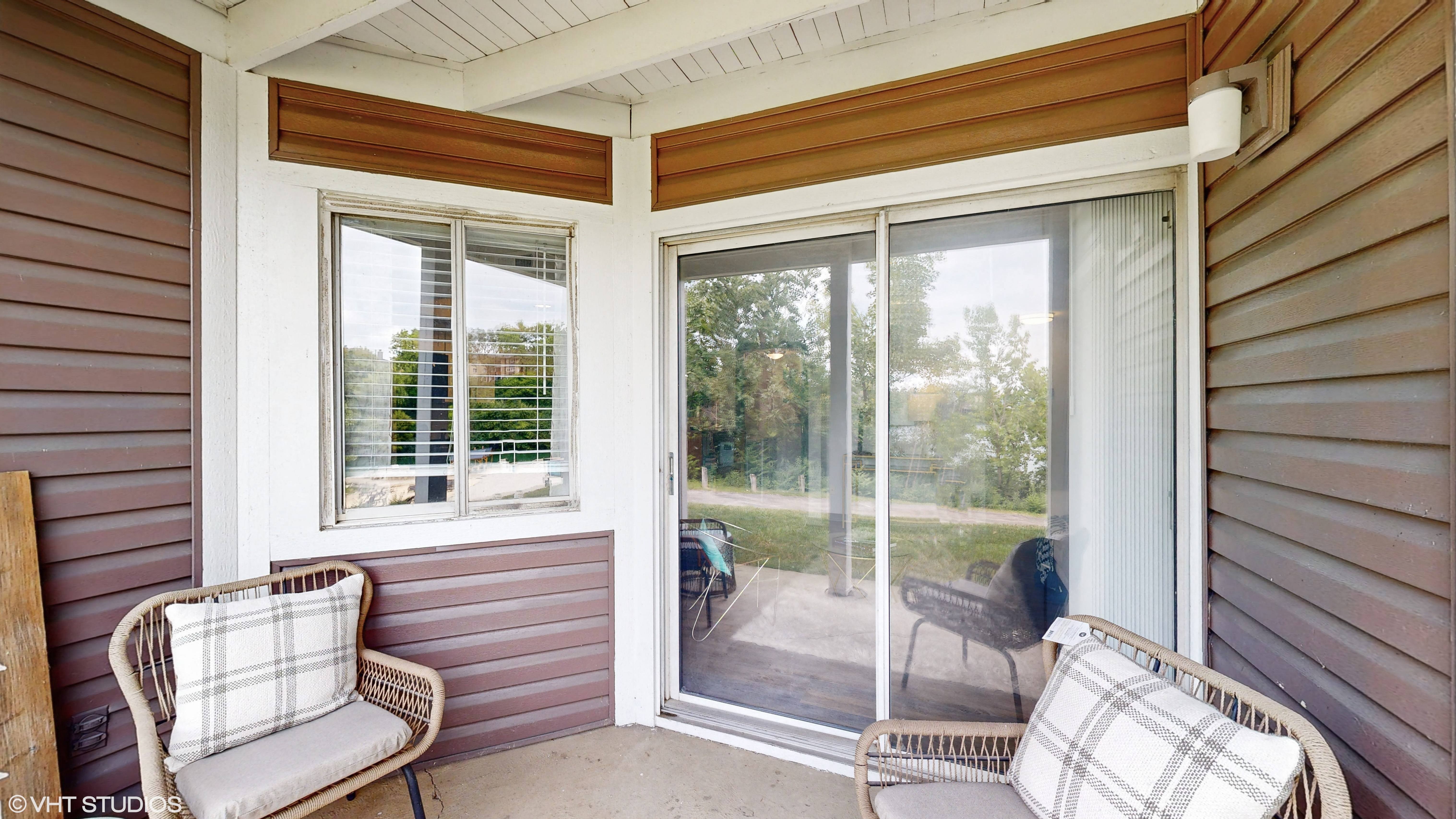apartment covered balcony with seating