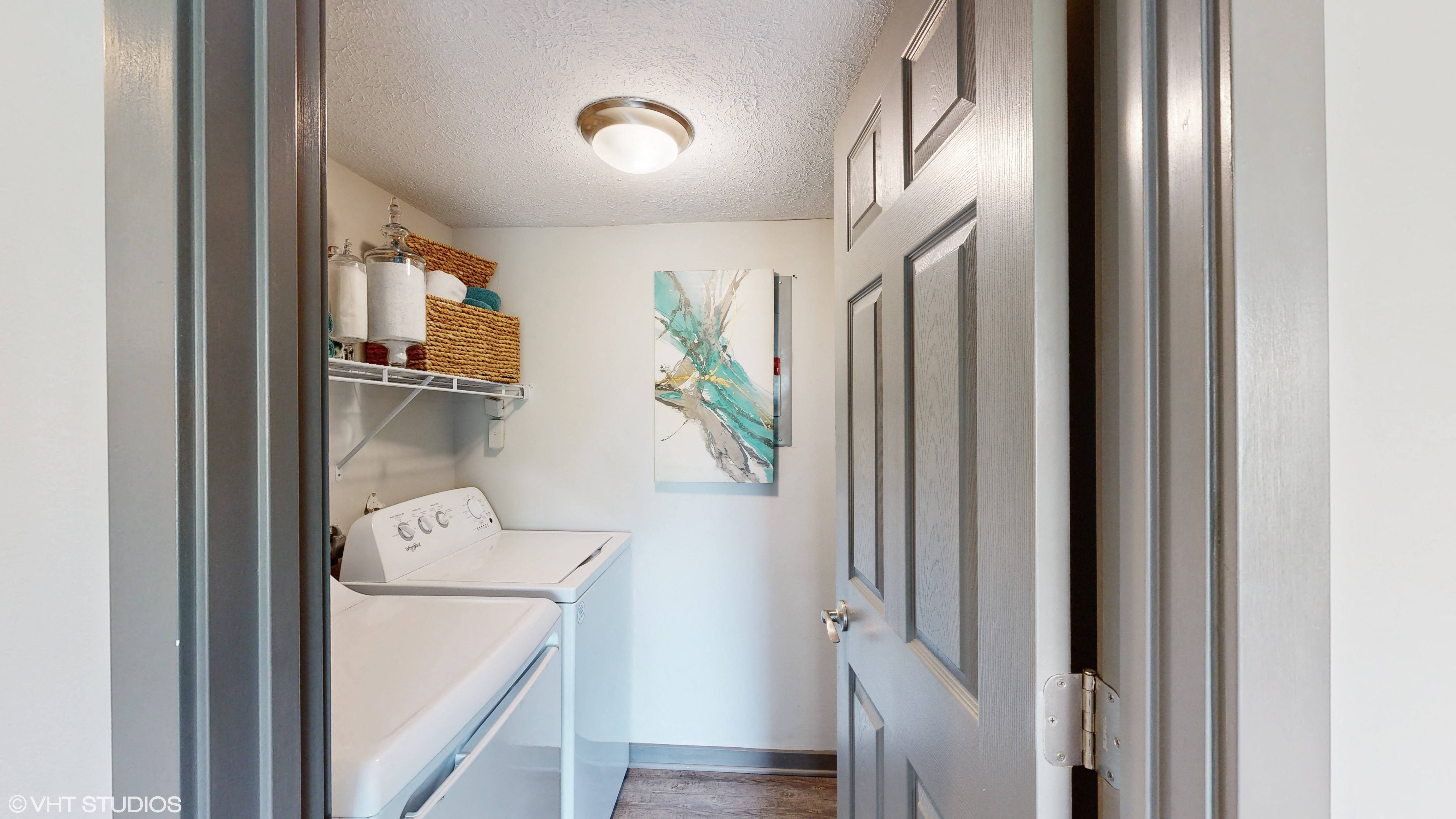 apartment laundry room with washer and dryer