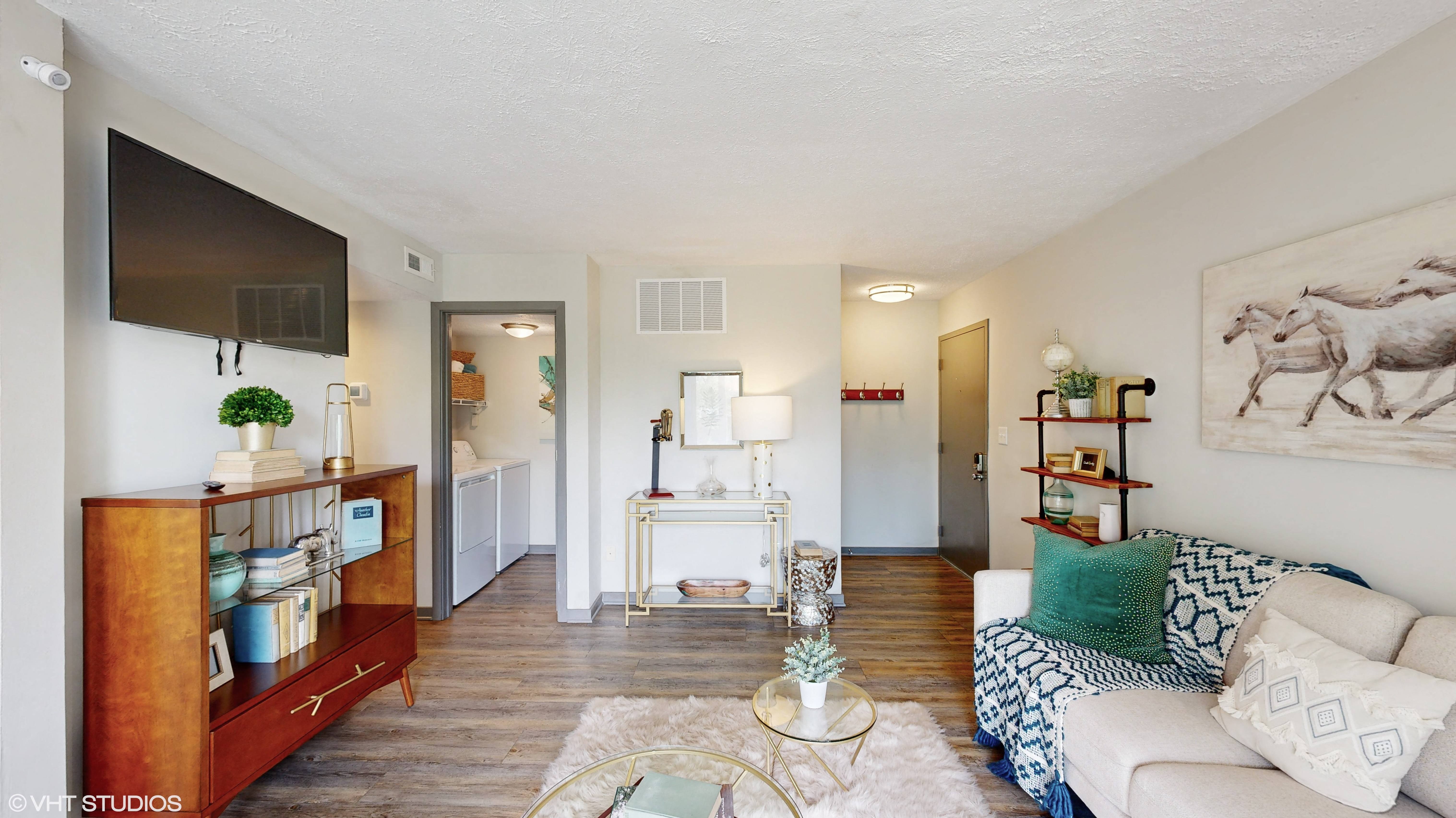 apartment living room with laundry area