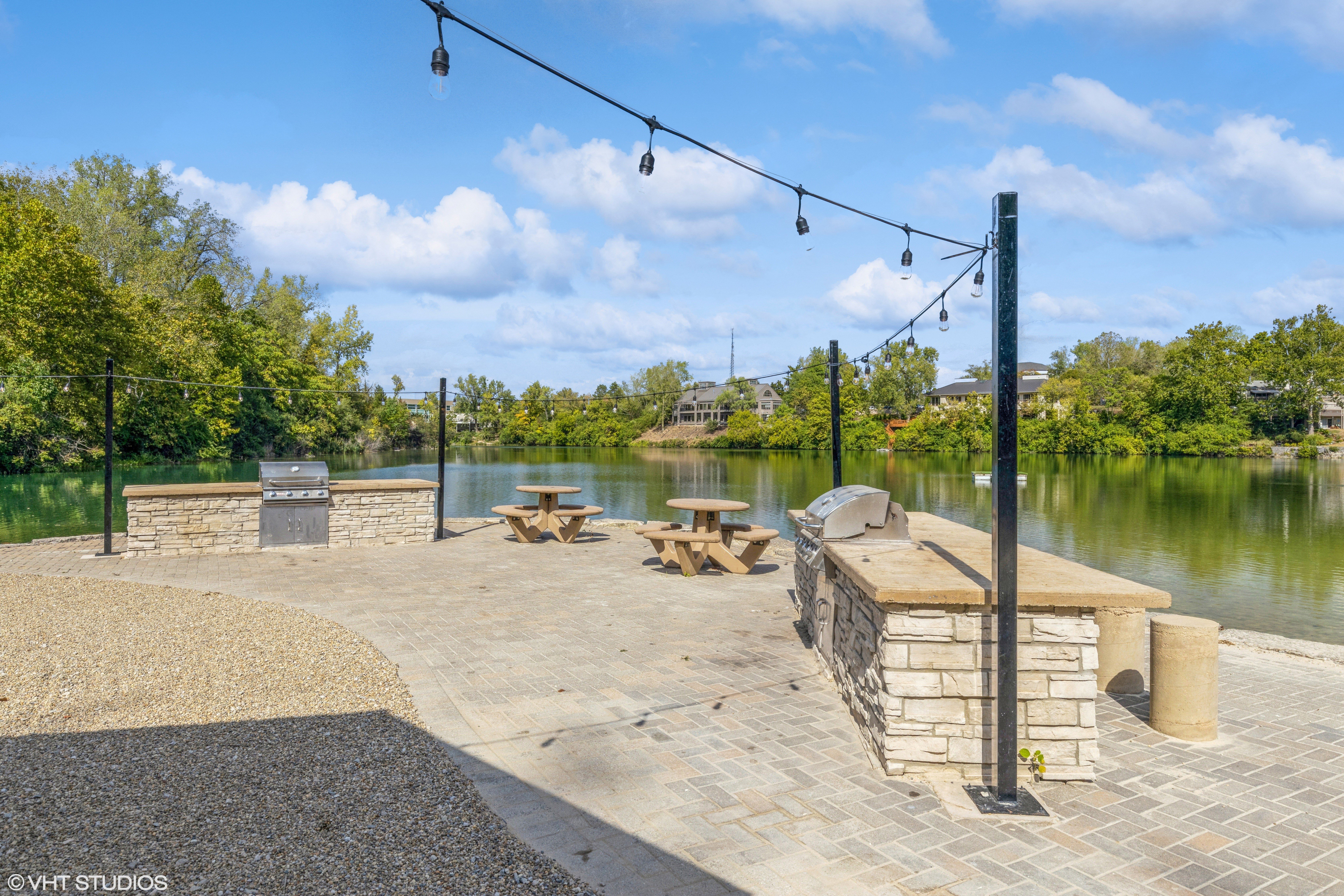 community lakefront grilling area with picnic tables