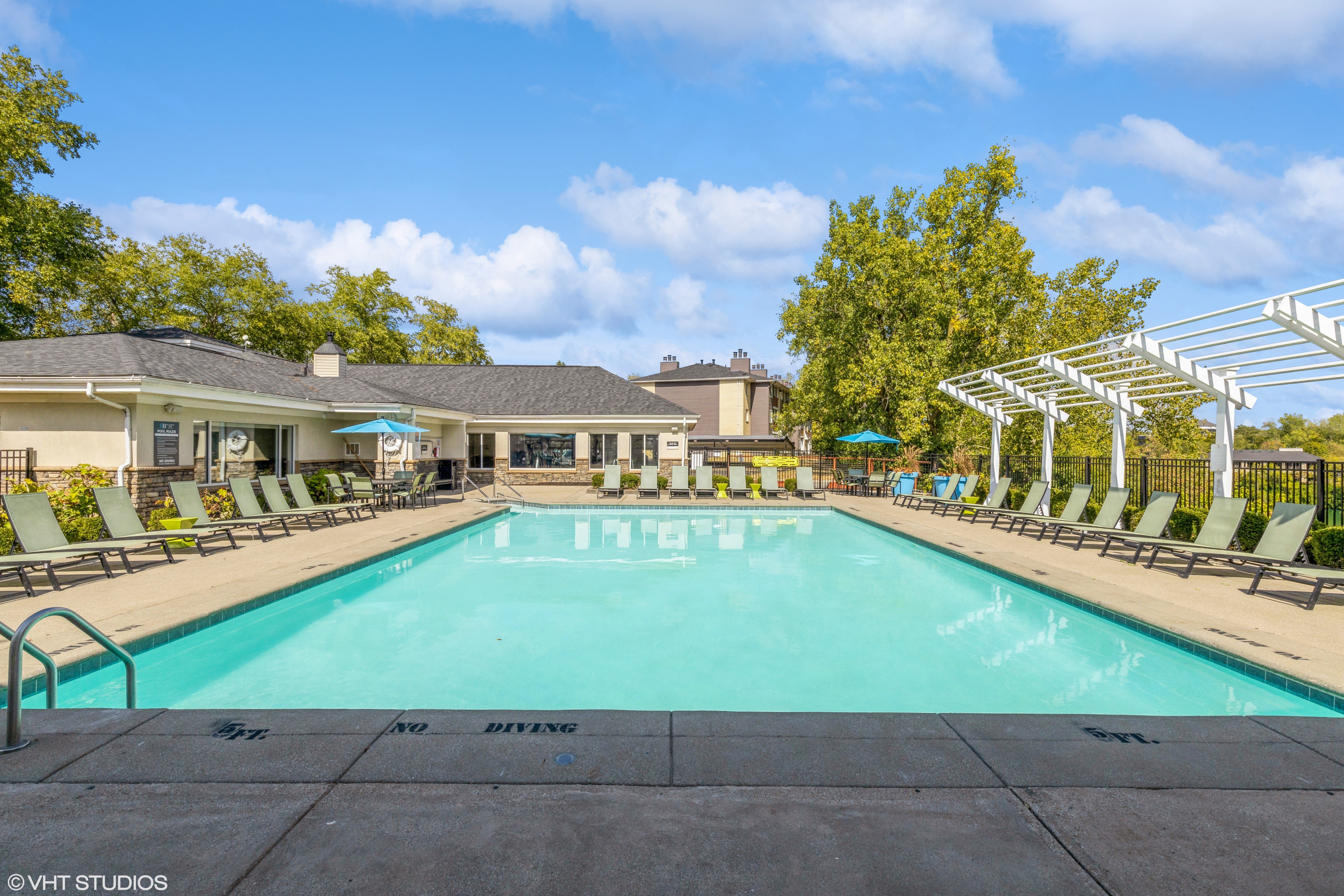 community outdoor swimming pool with lounge chairs 2